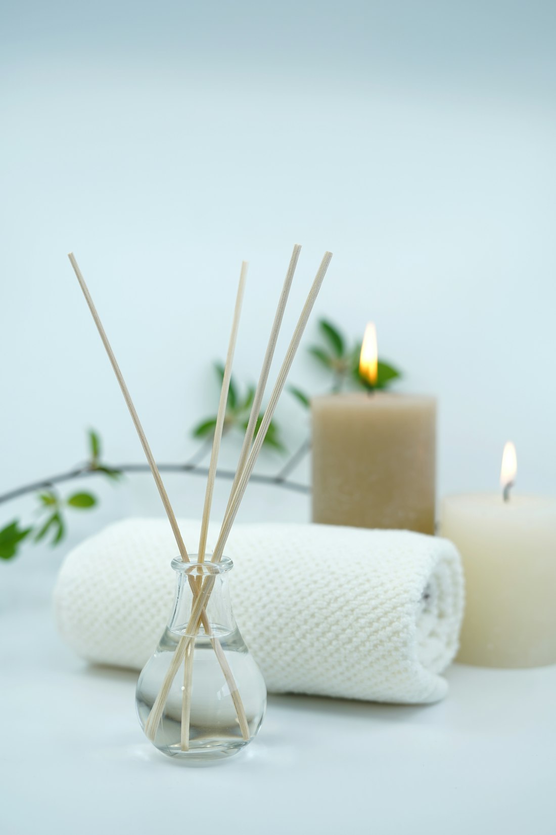 Calm spa setting with candles and towels